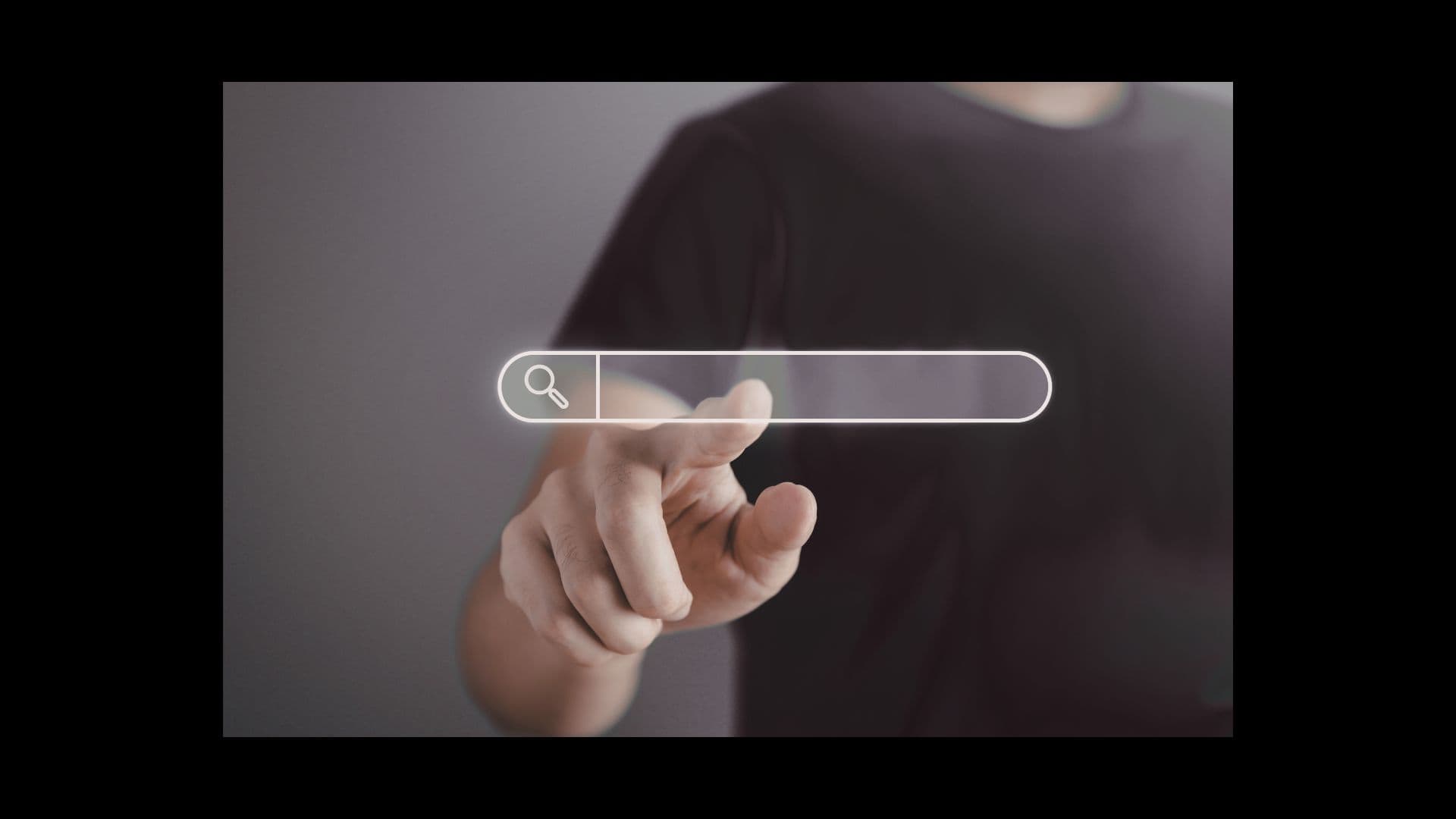 Person pointing at a search bar